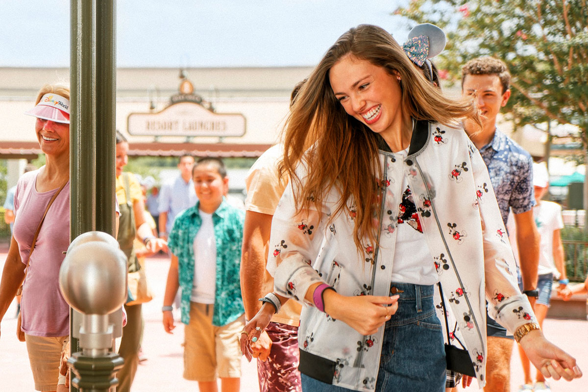 Visiting as a Guest Young woman entering a Disney Park